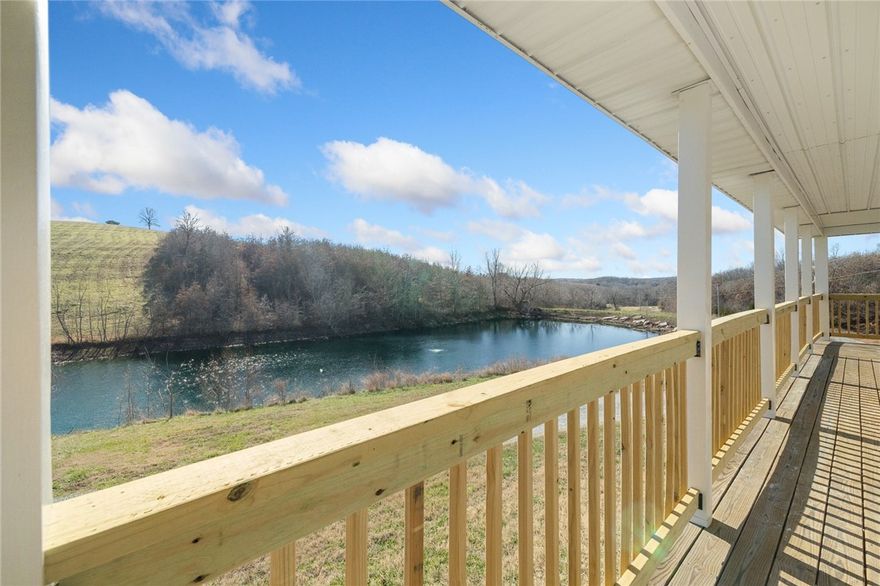 This unique 4 BR, 1 BA home (with soaker tub) offers 1344 sq ft of comfortable space with luxury vinyl plank flooring throughout. Plans are available to add a 2nd bathroom upstairs. Adjacent to the main home is a 38'x64' large workshop/motor home bldg with three 10 x 12-foot doors and one 12x14 ft door, housing a fully outfitted tiny home with 1 BR and 1.5 BA---perfect for guests or as rental potential. Powering this unique compound are 2 leased propane tanks---one 200 gallons, the other 330 gallons. A standout feature is a massive 52 ft diameter footprint excavated for a future round house, envisioned to rise 24 ft high.  The $23,000 pre-cut foam pieces will convey--making this the 3rd house on the property. The house features a spring-fed water system with a purification system, ensuring fresh clean water flows year-round. You'll also find not one, but two ponds, the larger, approximately 1.25 ac, is stocked with bass, crappie, minnows, blue gill, sun perch, and red ear. Peaceful living, room to grow and hunting!