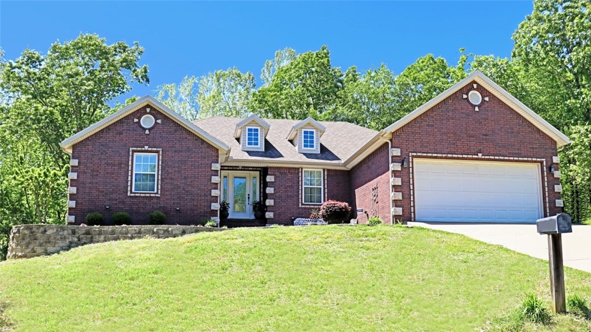 Beautifully updated w/ NEW EVERYTHING: Roof, HVAC, Hot Water Heater, Carpet, Tile, Dishwasher, Microwave, Backsplashes, Deck, Kitchen Countertops & Mstr Shower! Short walk to Loch Lomond, surrounded by greenscape & wildlife. Crown molding t/o, oversized mstr w/ tray ceiling, & inviting open concept floorplan. Lot north of hm is included the sale, is clear of leach lines & would be ideal to build an In-ground pool or Boat House! Septic is permitted for a 3 bed 2 bath. Septic is permitted for a 3 bedroom 2 bath and was serviced in the Fall of 2018. Owner is an Arkansas licensed real estate Broker.