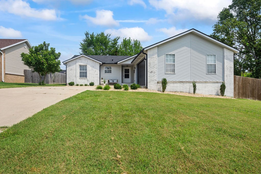 Just a mile from the heart of Downtown Bentonville and minutes from some of the best biking trails in the world, this charmingly updated home offers the perfect blend of lifestyle and location. Tucked away on a quiet cul-de-sac near the new Walmart campus, Crystal Bridges, and Airship Coffee, itās an exceptional opportunity for a personal residence or turnkey short-term rental. Inside, the open-concept kitchen features quartz countertops, stainless steel appliances, and a modern layout that flows into the living and dining areaāperfect for hosting or daily living. The spacious primary suite offers a private retreat with a walk-in closet, soaking tub, and frameless glass walk-in shower. A split floor plan includes two additional bedrooms and a full bath, offering comfort and privacy for family or guests. Step outside to a generous patio and fully fenced backyardāgreat for entertaining, relaxing, or even RV parking. Bonus: fridge, washer, and dryer convey. Furnishings available separately.