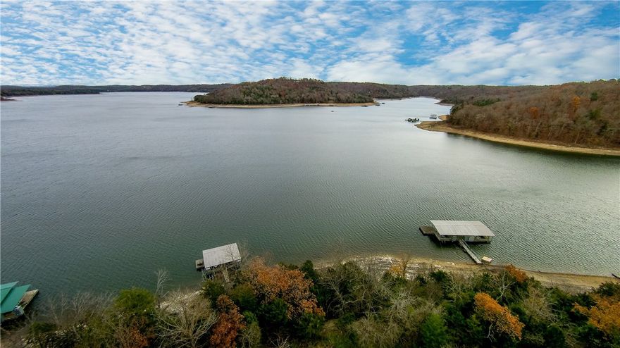 This absolutely stunning waterfront home has gorgeous views from almost any room in the house looking out to Beaver Lake. With over 5,200 sq ft of open floor plan, vaulted ceilings, wall to ceiling windows and a finished basement which host 3 large bedroom suites, a full kitchen, laundry room and family room with access to the covered 2 level deck/patio and pool. With attention to details throughout the home in every room this home is absolutely beautiful inside and out and is a MUST SEE LISTING!