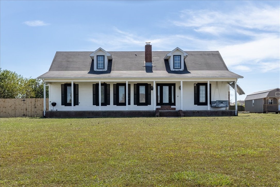 Rare 1-acre opportunity in the heart of an established subdivision in Centerton! This expanded 4-bed, 2-bath home offers space, charm, and flexibility—plus a unique lot size rarely found within city limits. A recent addition adds a fourth bedroom, perfect for guests, work-from-home, or multigenerational living. Inside, enjoy a cozy living room with a brick fireplace, vintage kitchen with mint-green tones, and a sunroom full of natural light. The primary suite features a double vanity, soaking tub, and separate shower. A well-loved space with room to grow—ideal for those eager to renovate and personalize. Outside, the fenced yard and covered porch invite quiet mornings and lively gatherings. With room to garden, build, or simply spread out, this property offers rare potential in a prime location. Whether you're a first-time buyer, investor, or looking to customize your forever home, this one delivers space, character, and opportunity—all in one.