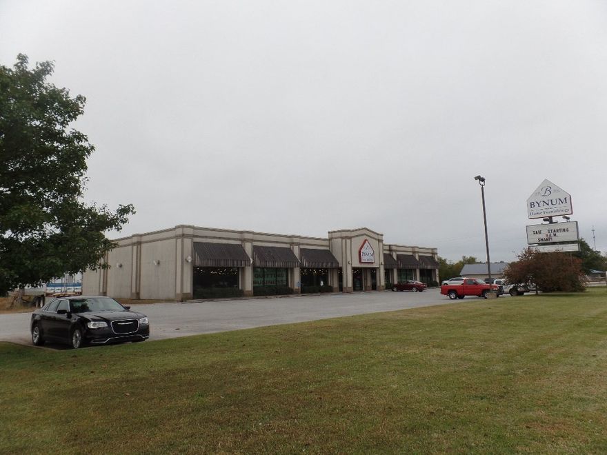 Prime commercial opportunity with Highway 412 frontage. Perfect for retail or multi-purpose. Extra lot for room to grow your business.