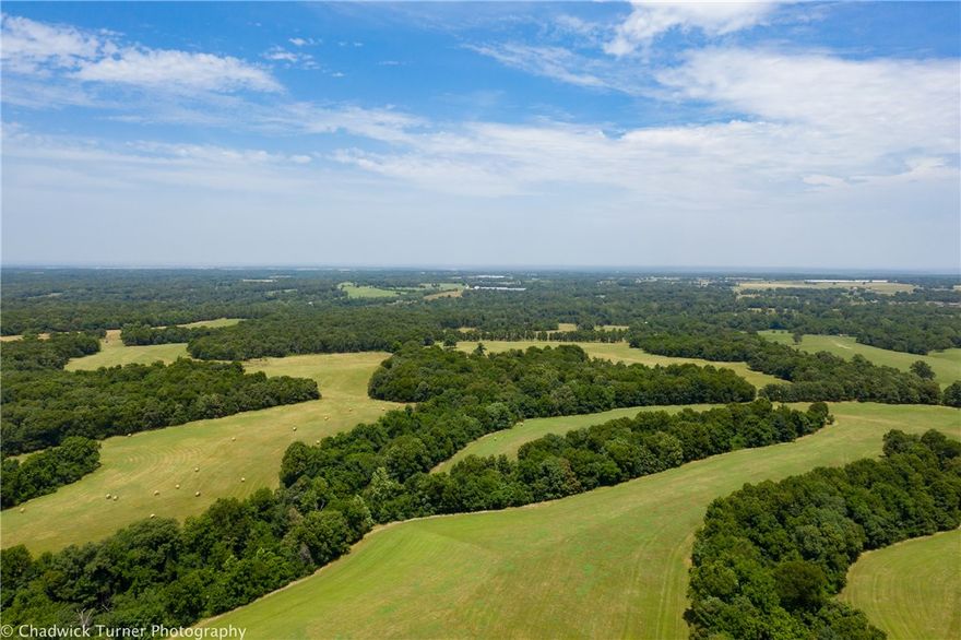 TAKING BACK UP OFFERS 418 Acres M/L with a barn and a stocked, 3 spring fed ponds and a year-round creek. Full corral system, shop. This mixed use recreational, timberland, ranchland has multiple access points with road frontage on Honey Creek Rd (paved), Gene Law Rd, and Wann Rd allowing entrances from South, East, & Northern sides of the property. An old home site has electricity on the property and rural water lines at Wann Road (buyer to confirm all utilities). Fenced and cross fenced, tons of wildlife, multiple ponds & creeks. Truly beautiful. See photos and attachments for Parcel/Acreage lists.
