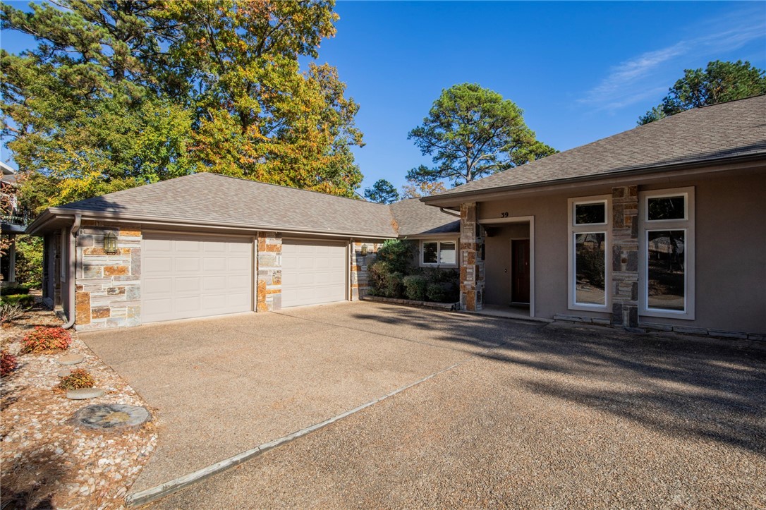 This well-maintained townhouse overlooks Lake Norwood and offers 1946 square feet of peaceful living. This 3 bedroom, 2 bathroom home has a split floor plan. The primary bedroom is spacious, with a walk-in closet. From the primary bedroom or living room, step into the heated/cooled sunroom for year-round use. Enjoy lake views from the sunroom or extended back deck. Cozy up next to the living room fireplace and admire the cathedral ceilings. The kitchen is a chefās delight with a beautiful bar and large pantry. The oversized 2 car garage and basement offer ample storage. This home is in a PRIME location - easy access to the hwy, golf courses, mountain bike trails, restaurants, & more, with grocery shopping an easy walk away. This home is only a 15 minute beautiful drive to downtown Bentonville and an easy commute to the Walmart Home Office. Located in the popular Bentonville School district. On SEWER! Move in ready! This home offers the perfect opportunity for serene & peaceful living!