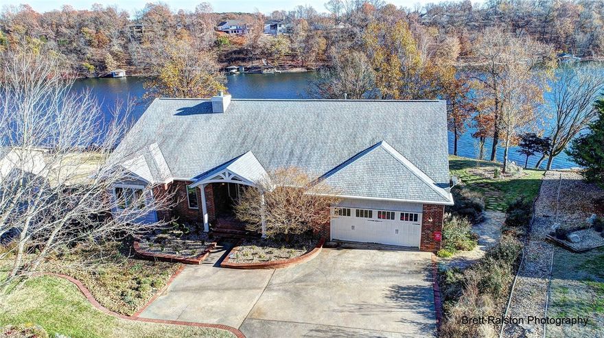 Luxuriously updated lakefront home on Loch Lomond! Truly One of A Kind! Very easy slope to lake w/private boat dock & waterfall w/brook. Plantation shutters, built-ins galore, laundry on each level, coffee bar in pantry, kitchenette on lower level, hot tub room w/sauna, Pella windows, motorized shades, extra 131 sqft storage area in garage, 300 sqft screened porch, LED lighting, solid oak hardwood flooring, pull out ironing board and butcher block drawers, Bose surround system…See attachment for updates.
