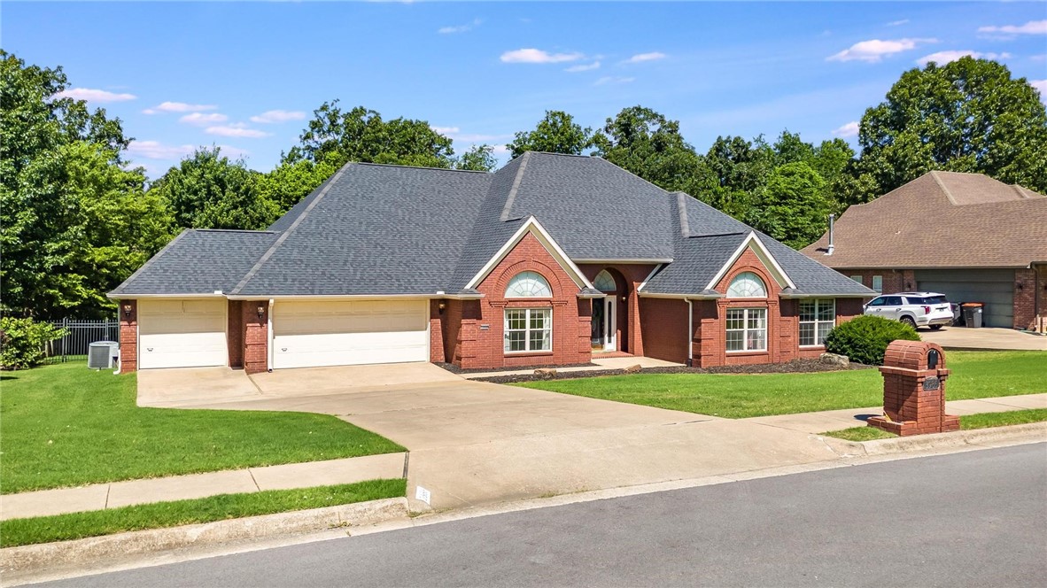 Tucked into the beautiful, tree-lined and sought-after Monticello Subdivision with friendly neighbors and a great location convenient to all of NWA! This all-brick 4BR/3BA beauty offers spacious living with vaulted and tray ceilings, formal dining room, den, and large living area with gas FP. The main BR suite features a double-sided fireplace, 2 walk-in closets, private deck access, and an oversized bath with great space and potential to personalize. Enjoy multiple living areas, 3 more spacious bedrooms with ample closet space, and tons of natural light throughout. The layout offers flexibility for entertaining, working from home, or hosting guests. Storage is generous, and the neighborhood is known for its peaceful charm and convenient access to schools, shopping, and dining. Roof and gutters were new in 2021. Priced to allow future owner to update and refresh, this home is packed with potential, is move-in ready with some updates done, but room to make it your own. Don’t miss this MUST SEE opportunity!