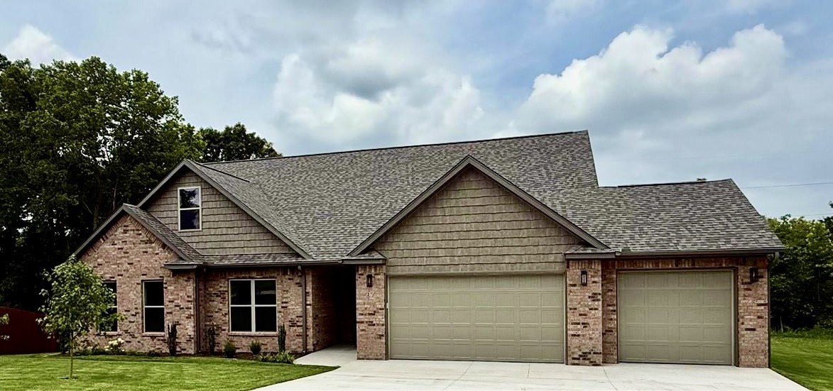 NEW TOP QUALITY BELLA VISTA HOME FROM EXCEPTIONAL BUILDER! This thoughtfully designed 3-bedroom, 3-bath residence showcases a light and spacious kitchen with quartz countertops, custom built cabinets and a large walk-in pantry.
Enjoy a great room with 11’ ceiling and a unique stone fireplace - perfect for cozy evenings and entertaining. By day, oversized, energy-saving windows illuminate the home with natural light. The main bedroom suite includes a walk-in closet and a bath with double vanity, custom tile shower and soaker tub. Also on the first floor are two other bedrooms and a full guest bath with double vanity and shower/tub. The second floor offers a huge bonus room with lots of light and 3/4 bath with shower. The walk-in attic is floored and ready to use!
Large, covered deck is ideal for gatherings with family and friends, and home has a three car garage.