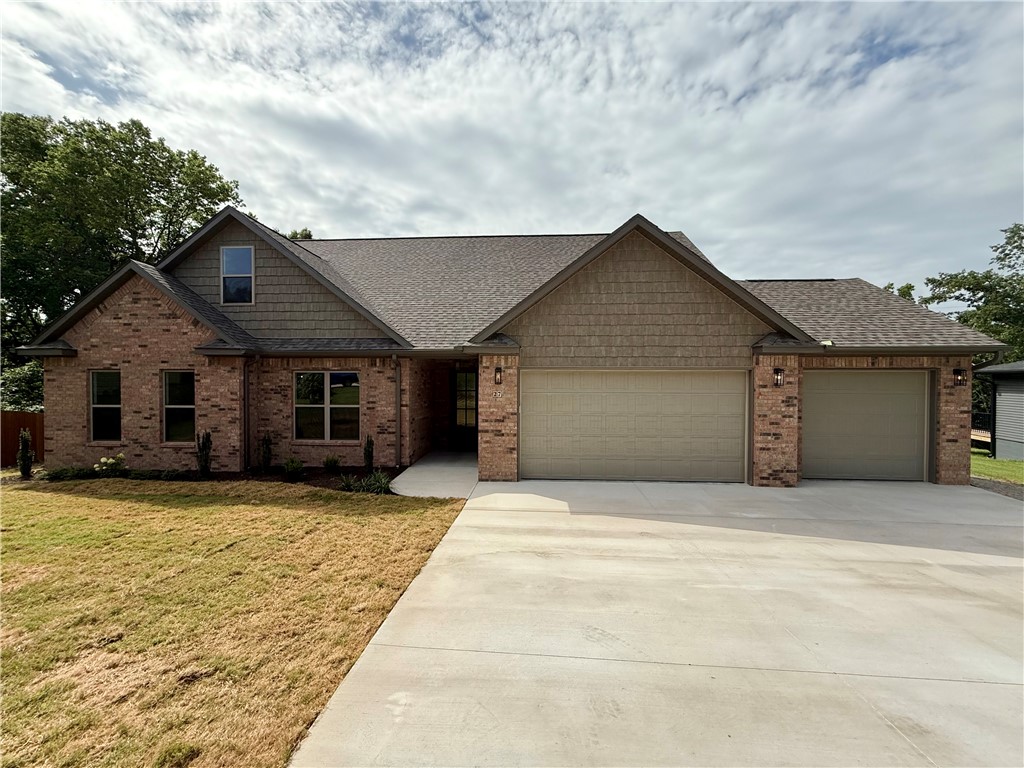 NEW TOP QUALITY BELLA VISTA HOME FROM EXCEPTIONAL BUILDER! This thoughtfully designed 3-bedroom, 3-bath residence showcases a light and spacious kitchen with quartz countertops, custom built cabinets and a large walk-in pantry.
Enjoy a great room with 11ā ceiling and a unique stone fireplace - perfect for cozy evenings and entertaining. By day, oversized, energy-saving windows illuminate the home with natural light. The main bedroom suite includes a walk-in closet and a bath with double vanity, custom tile shower and soaker tub. Also on the first floor are two other bedrooms and a full guest bath with double vanity and shower/tub. The second floor offers a huge bonus room with lots of light and 3/4 bath with shower. The walk-in attic is floored and ready to use!
Large, covered deck is ideal for gatherings with family and friends, and home has a three car garage.