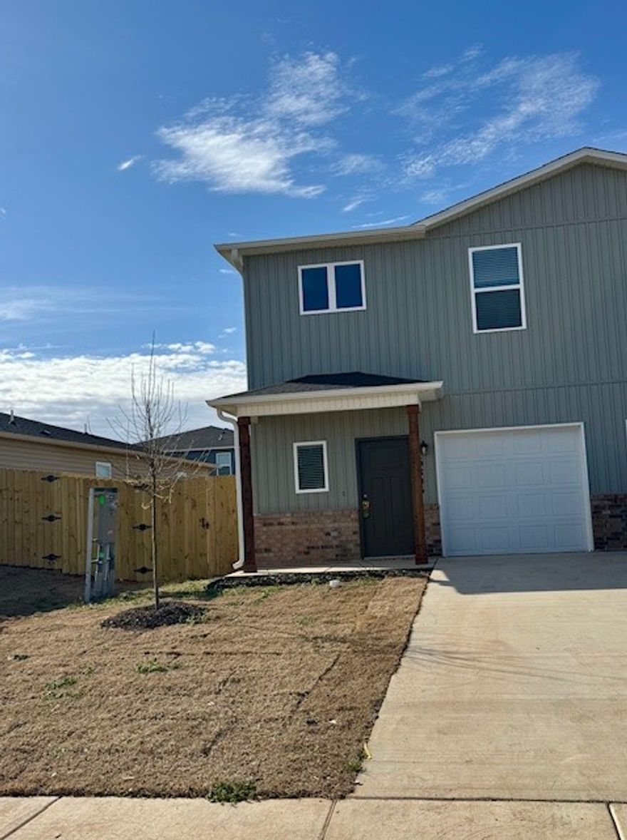 This 3 bedroom, 2.5 bath townhome offers 1,599 sq. ft. of comfortable living space with a 1-car garage. Inside, you'll find an inviting open layout, plenty of natural light, and modern finishes that make the home feel bright and welcoming. The kitchen comes fully equipped with a fridge, dishwasher, stove, and microwave, while the washer and dryer make everyday living easy and stress-free. This is a pet friendly property.  Please note, lawn care is not included. Located in a great spot, this home is perfect for anyone wanting a modern yet cozy space with convenient access to all the best of Northwest Arkansas. **Pics may not be of exact unit**