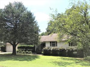 Clarksville home with 2400sqft home in Cedar Hills Subdivision. 4 bedrooms, and walk out basement for second living area or recreation room or both! Vaulted ceilings with wooden beam work and wood burning fireplace in main living area. Private back yard setting with shop building and multiple deck levels and patio spots for entertaining.