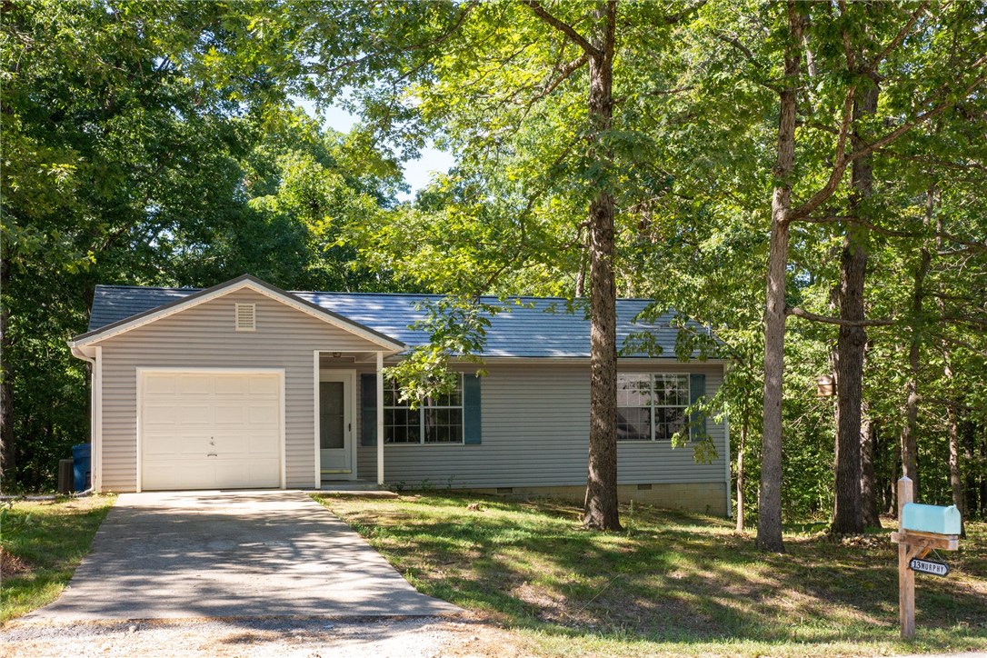 Very nicely updated starter home or small family home. It could also be used as an AirBnB as it sits within steps to the new mountain bike trails in Bella Vista and also is a very short distance to I49. Updates include new flooring throughout, totally updated kitchen including new cabinets and red oak countertops, new tile backsplash, and new appliances. A stackable washer and dryer and refrigerator convey with the property. There is a nice storage shed in the back yard.