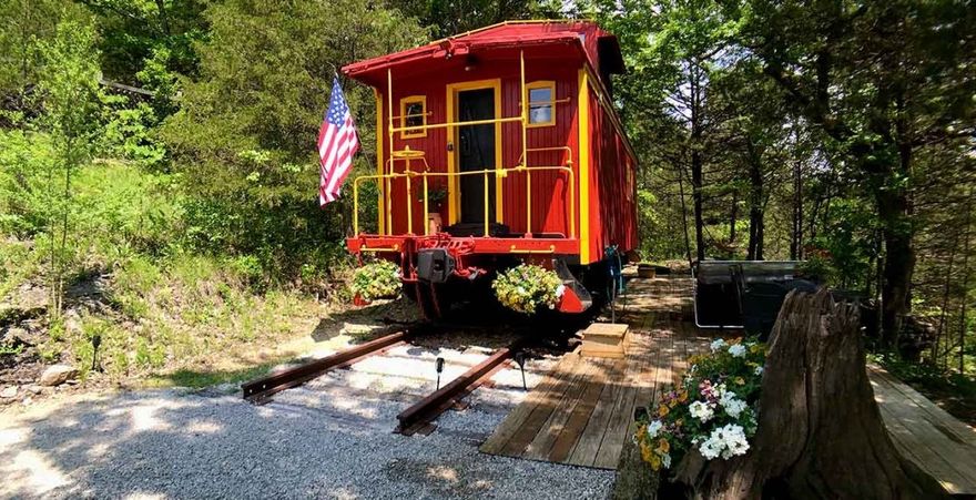 Successful nostalgic overnight hospitality business is nestled on the Livingston Junction mountainside. 2 miles south of Eureka Springs, Arkansas. Each of the 3 cabooses and 2 cabins is isolated and private enjoying a marvelous view of the historic site of railroading as it was in days gone by. All units recently updated/upgraded and decorated to create a unique, romantic, cozy, comfortable and nostalgic lodging. New 5th unit conductor cabin for 2025 projected to add 40,000 add'l revenue based on other unit performance. Many loyal customers enjoy all seasons as hikers, sightseers, tourists, bird-watchers, photographers, bikers, horseback riders and canoeists enjoy the remarkable beauty and serenity the area offers. Impressive average 4.9 stars reviews on all social media.