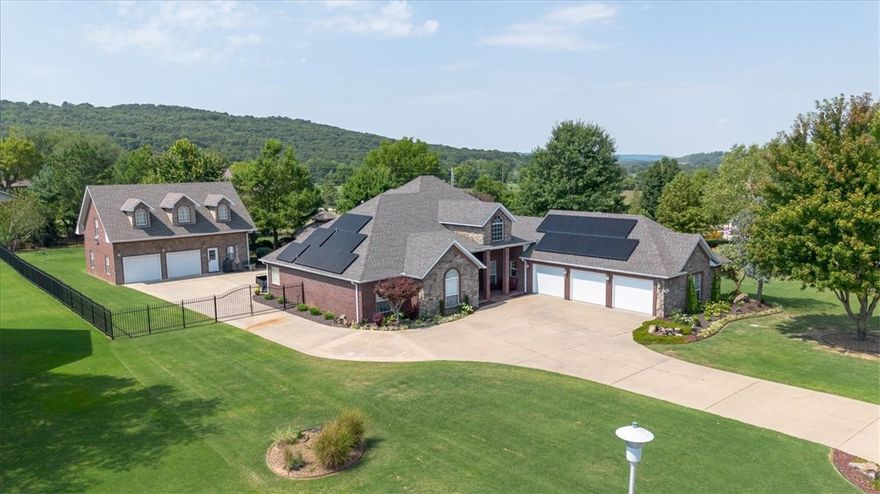 Amazing 1 level home includes sunroom, three-car attached garage & two-car detached garage with 999 SF garage/workshop/apartment(999 sqft not included in house sqft). Spacious 3 bedrooms & office, den w/wet bar, outdoor living space with gazebo, firepit & water feature. House sits on a little over one acre & backyard has wrought iron fence. Home features smart switches, dimmers, smart irrigation, & solar system that is capable of running off grid or on grid with additional battery backup & is Wi-Fi connected to be monitored & controlled. The HVAC systems are Trane high efficiency heatpumps with 2 additional gas furnaces for backup/extreme cold temps that were installed in Dec. 2021. The outbuilding upstairs is stubbed for a kitchenette. Some furniture does convey &/or be purchased with the property. Window heat/air pump in garage & in the outbuilding does not convey. The makeshift garage wall in outbuilding can stay or be removed as it is not attached. Property can have a pool in the backyard.