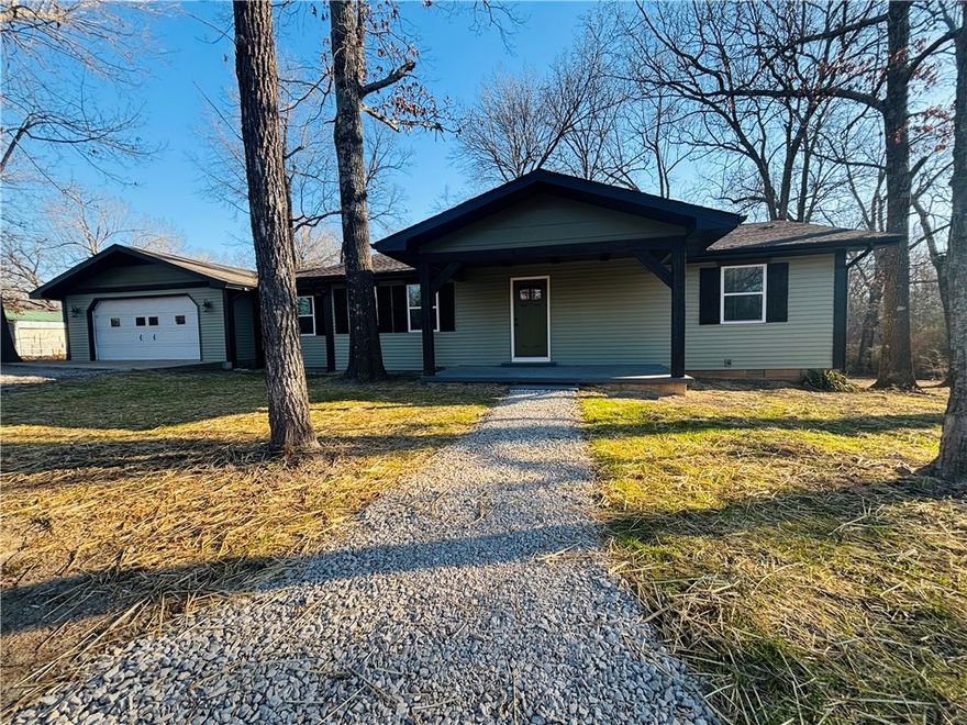 Enjoy the feeling of country living while being conveniently nestled just outside of town. This beautifully remodeled 3-bedroom, 2-bath home inFlippin offers space, updates, and a setting that is increasingly hard to find. Situated on 1.57 acres m/l, the home features an open floor plandesigned for easy flow between the main living area, family room, and updated kitchen. Recent improvements include new flooring, new roof,new windows, new trim and paint, siding, and a newer HVAC system for added efficiency. Both bathrooms have been fully updated, and thekitchen includes new appliances, an island, and soft-close cabinetry. Step outside to enjoy the new deck overlooking your landscaped acreage,perfect for quiet mornings or evening gatherings. A two-car attached garage adds everyday convenience and storage. If you have beensearching for a move-in-ready home with room to breathe while staying close to town, this property is worth a closer look.