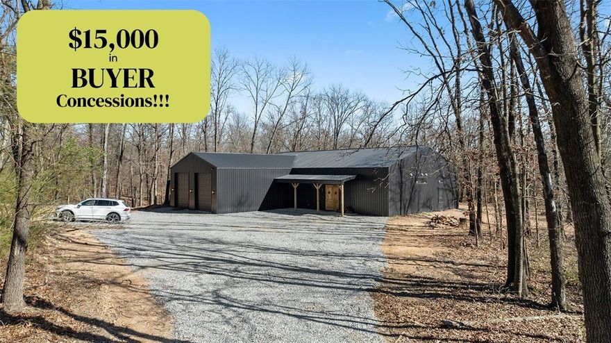 $15,000 IN BUYER CONCESSIONS with favorable offer! Use for closing costs, rate buy-down & more. Don't miss this custom, modern, metal home on 10.56 ac +/-. Cedar doors welcome you into an open, split-floorplan featuring sealed concrete floors, 12' ceilings,  floor-to-ceiling wood-burning fireplace flanked by French doors leading to a large covered patio to enjoy nature. Kitchen features Bosch appliances, incl fridge, farm sink in a 10'ft quartz island perfect for entertaining. Primary ensuite features separate vanities & walk-through wet room with large soaking tub & shower. On the other side of the home are 2 bedrooms with private baths, bonus room with garage door to outdoors & private office. 900 sqft insulated garage features RV-height doors. Home includes hot water recircul., spray foam in exterior walls, back porch wired for hot tub & can lights, 2 garage door motors to convey. $10k-$16k to complete projects. Estimate available. PRICED WELL BELOW RECENT APPRAISAL! 2 parcels. Must have pre-qual or VOF to tour.