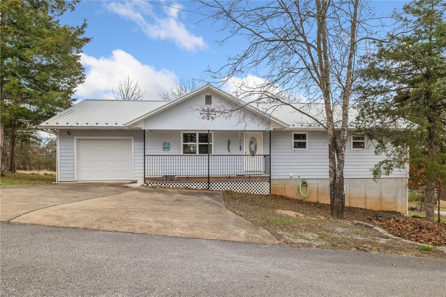 Wake up to beautiful views of Bull Shoals Lake from this custom-built 3 bed, 2½ bath home in Diamond City. Completed in 2014, this well-crafted home features hardwood floors, custom cabinetry, & an open-concept living and kitchen area with stunning vaulted car siding ceilings. The spacious layout offers the perfect place to relax, entertain, & enjoy the natural beauty of the Ozarks. Recent improvements include an updated HVAC system installed in Sept 2025. The current layout also offers excellent flexibility, with the basement set up to function as a separate nightly rental if desired, complete with its own kitchenette ideal for guests, extended family, or income potential. Conveniently located approx 35 min to Harrison, 45 min to Branson, & an hour to Mtn Home, this property offers the perfect balance of lake living with access to shopping, dining, and entertainment. If you're looking for a full-time residence, vacation getaway, or investment opportunity near the lake, this property is ready to welcome you home.