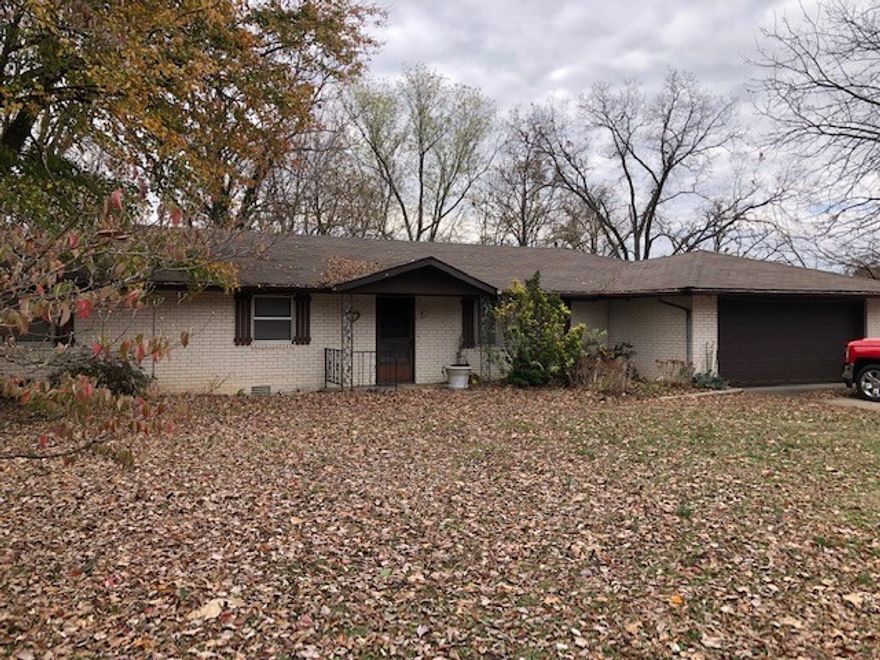 Potential development in high-use Rogers commercial area; 2.49 acres +/-; Currently zoned A-1; The dwellings on this property may have no value; Arkansas Highway Department Daily traffic count is 23,000 cars per day.  All city utilities/internet on property.