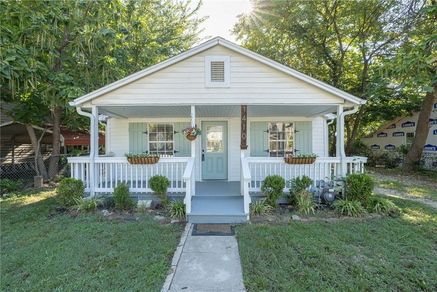 Charming move-in-ready 3 bedroom, 2 bath cottage style home in south Fayetteville. Features include new LVP flooring throughout the home, fresh interior paint, updated main bathroom with gorgeous new tile. Enjoy spacious walk-in closets, updated light fixtures in living and dining room, and a newer roof for peace of mind. Relax on the covered front porch or move back to the wood deck on the back for privacy both sanded and repainted, gutter guards. Home recently had an energy audit with additional insulation and new sealing of windows and doors. Nice backyard for cookouts. Close to the University and the Fayetteville Square. The outbuilding is probably a tear down. Selling "as is".