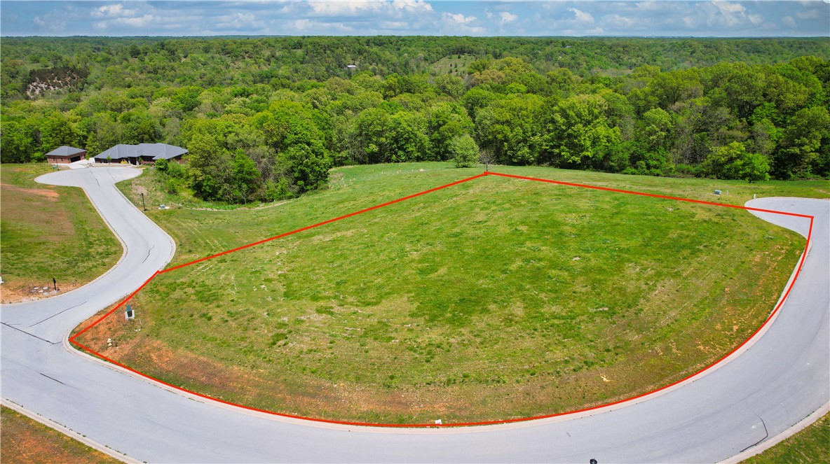 Come build your dream home on this beautiful, top lot in the gated subdivision of Creekstone Estates. At 1.69 acres, this corner estate lot provides fabulous views near world class biking and is zoned to top-rated Bentonville Schools. Complete architectural plans for a single story, 7500 square foot modern farmhouse specifically tailored for this expansive corner lot, available upon request.