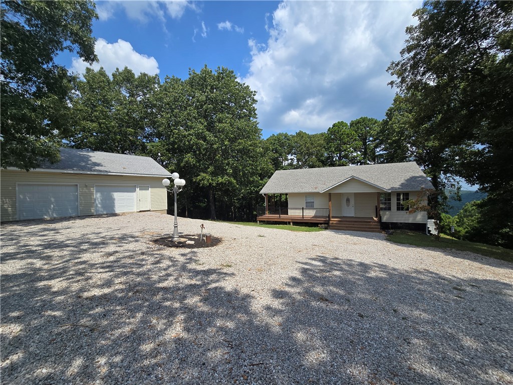 Charming country retreat on 15.67 peaceful acres! This 3BR, 2BA home offers over 2,300 sqft of thoughtfully updated living space, including a fully finished basement- perfect for extra living or entertaining space. Enjoy morning coffee or evening sunsets from the spacious back deck with mountain views, and take advantage of the detached garage and workshop, ideal from hobbies, storage, or work-from-home projects. Perfectly positioned between Harrison, AR & Branson, MO, this home gives you the best of both worlds | privacy and seclusion, yet convenience to shopping, dining, and outdoor adventure. Don't miss this move-in ready gem! Schedule your private tour today!