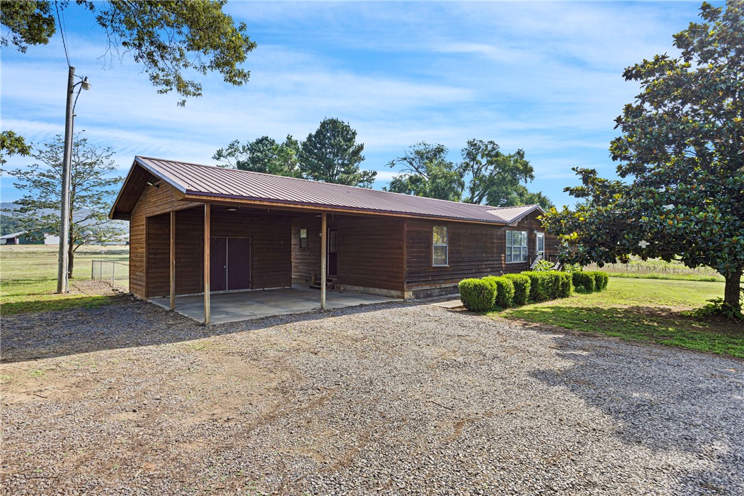 Looking for space to spread out? This 2-acre property offers stunning views of Mt. Magazine and the room your family needs to thrive. The 1,900 sq ft home features a spacious layout with 4 bedrooms and 3 full baths—plenty of room for everyone. Enjoy a fenced backyard, perfect for outdoor family time, plus a covered carport with built-in storage. Need even more space? The impressive 40x60 shop is fully concreted, and includes a bathroom and mancave that's heated and cooled. Whether you're into hobbies, running a business, or dreaming of the ultimate hangout spot, this versatile space delivers.
Don’t miss your chance to enjoy peaceful country living with modern amenities and room to grow!