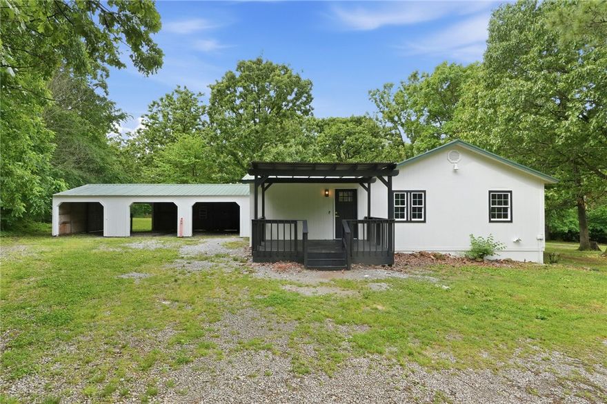 Tucked away at the end of a quiet street on 2.08 acres, this fully renovated 3-bedroom, 2-bath home delivers true country living with no close neighbors in sight. Nearly everything is brand new — metal roof, fresh exterior & interior paint, LVP flooring, carpet, tile, LED lighting, doors & hardware, and a beautifully updated kitchen with quartz counters, new cabinets, and new appliances. Both bathrooms are completely refreshed — the primary bath showcases a stunning walk-in shower, while the hall bath offers a tiled tub/shower combo with new vanities and fixtures. Cathedral ceilings, ceiling fans, walk-in closets, a mud room, extra storage, storm shelter, and a 3-car attached carport/garage round out the package. Outside, enjoy the covered deck and porch with a detached storage building on the grounds. Gentry public water runs along Dawn View Dr and is available at the street. Near walking trails and just minutes from City Lake Park & Lake Flint Creek. No POA.