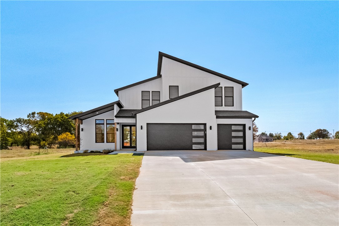 Welcome to this new custom home on a 1-acre lot, promising luxury & sophistication. 4 beds, 3 baths & a 3-car garage, offering ample space for modern living. Step inside to an open living area with sleek finishes & natural light. Large sliding doors seamlessly connect the indoor & outdoor spaces, leading you to the covered back patio, perfect for entertaining guests. The gourmet kitchen is a chef's dream w/ quartz counters, designer backsplash & top-of-the-line built-in appliances. Large walk-in pantry has ample storage space for all your culinary needs. Retreat to the luxurious primary bedroom & show-stopping bathroom w/ large soaker tub & double walk-in shower. The private patio through the sliding door offers a tranquil escape. Additional bedroom downstairs proves versatility & comfort, while the upper level w/ two bedrooms & large bonus room ensures ample space for the family to unwind & recharge. A true oasis of modern elegance.