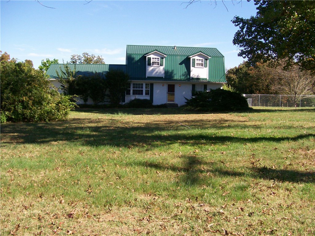 Large beautiful four bedroom home with a great view on 3.15 acres. lot size allows for split. Country living, but close to town. Raised beds in a fenced area. Private pond. Most of the property is fenced.