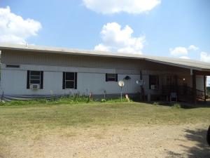 Good farming land. Large hay meadows, barn, fenced and x-fenced. Perfect cattle operation. Includes 1096 sq. ft. roof over mobile home at no value. Land lays all on North side of CR 2030