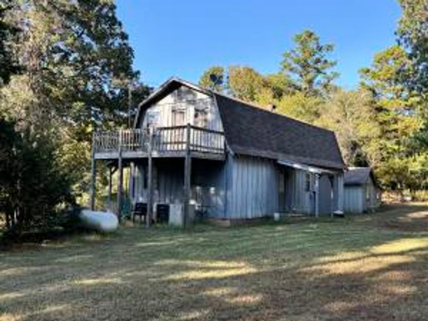 19+/- acres with a rental 3 bedroom 1.5 bath residence and 2 cabins is the perfect retreat or potential development.