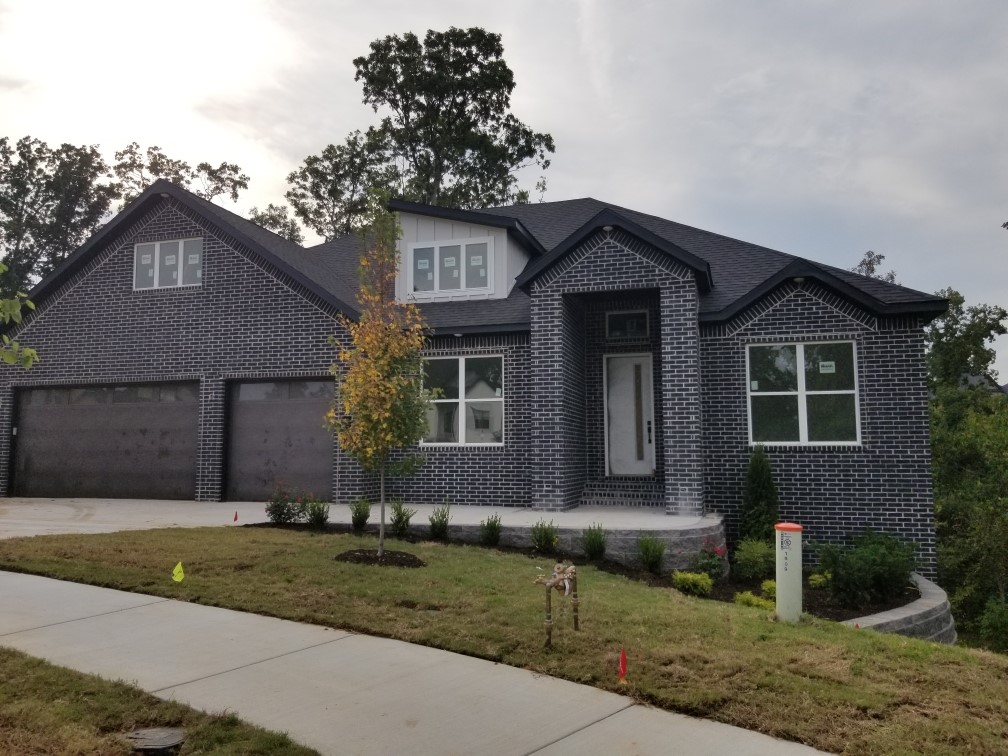 Stunning 5-bed, 5- full bath new construction with approx. 4,025 sq ft and a 3-car garage featuring 12-ft ceilings and 8-ft tall doors! This home offers 2 living areas, a media room (pre-wired for projector & 7.2 surround), office, wet bar, and two 10x22 covered decks. The living room boasts a 12-ft ceiling, electric fireplace, and accent wall, while the formal dining also showcases an accent wall. The chef’s kitchen includes LG appliances, gas cooktop, vent-out hood, built-in microwave & oven, plus a coffee bar. Bathrooms feature 2 walk-in showers and 3 tub/shower combos with 36” tubs and built-in storage. LVP flooring with moisture barrier throughout, with stairs featuring wood posts and metal cable railings. Outdoors you’ll enjoy a large backyard, sprinkler system front & back, a gas grill hookup, and a leveled driveway. Builder will contribute up to $5,000 toward buyer closing costs PLUS an additional $3,000 lender credit with preferred lender Kristi Cox at Nexa Mortgage (479-233-9450).