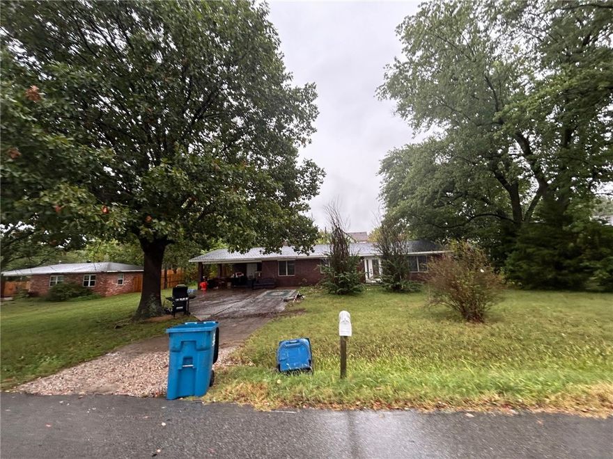 If you are looking for your opportunity to move to Small Town America but be minutes away from all the amenities you could ever want ( in Bentonville) look no further! This beautiful 3 bedroom 1 bath all brick home is close to schools, grocery shopping and parks! This home is ready for you to make your own and is need of some TLC. This home has a nice big living room that makes it perfect for entertaining. The main bedroom is exceptionally large and since this home is a split floor plan it stays more quiet. The large back yard would be perfect for you to add a pergola, a fire pit, or even a garden! The large laundry room / mud room helps keep the mess out of the rest of the house. Newer roof! Newer hot water heater! With a little elbow grease this house would shine!