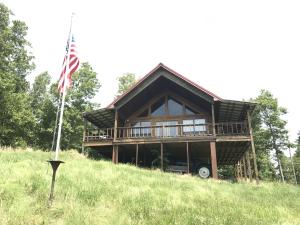 Awesome View of Buffalo River valley, forests, hills and flowing river below. This rustic cabin with beautiful finished wood floors, walls and ceilings with wrap around deck on 3 sides and new heat pump in 2015. Loft holds three beds for large groups as well as two full bedrooms. Large trees in yard. See to appreciate. View is breath taking!