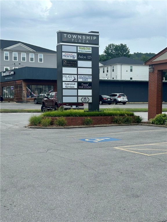 Office Space for Lease - Prime Road Frontage on Township. Welcome to Township Plaza - Located in the heart of Midtown Fayetteville, this versatile office/retail suite offers an unbeatable location for your business. Featuring a spacious showroom, a large stock room, and one bathroom. With direct road frontage on E Township, the building features both on-building signage and a prominent pole sign for maximum visibility. Clients and staff will appreciate the ample parking. Ideal for medical, retail, professional, or administrative use. Tenant pays utilities.