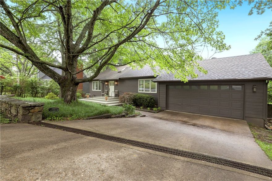 Introducing a beautifully renovated Mt. Sequoyah home, spread over a generous 3,216 sq ft. This charming home includes four bedrooms, 3.5 baths, and two primary suites. The layout features a spacious kitchen flowing into the living area, perfect for gatherings. The bonus living room also offers the flexibility of transforming into a game room, catering to your family’s needs.  Rich hardwood floors enhance the interiors, while outdoor amenities offer a half-court basketball pad, spacious yard, and an intimate outdoor living space. Enjoy privacy and tranquility with a fenced backyard nestled on a private wooded lot. The culinary enthusiast's kitchen comes equipped with painted cabinets and top-tier appliances. The warmth of two wood-burning fireplaces and the convenience of a two-car garage further add to the appeal. Nestled in the well-regarded Root Elementary School district, this refined Mt. Sequoyah residence is a must-see!