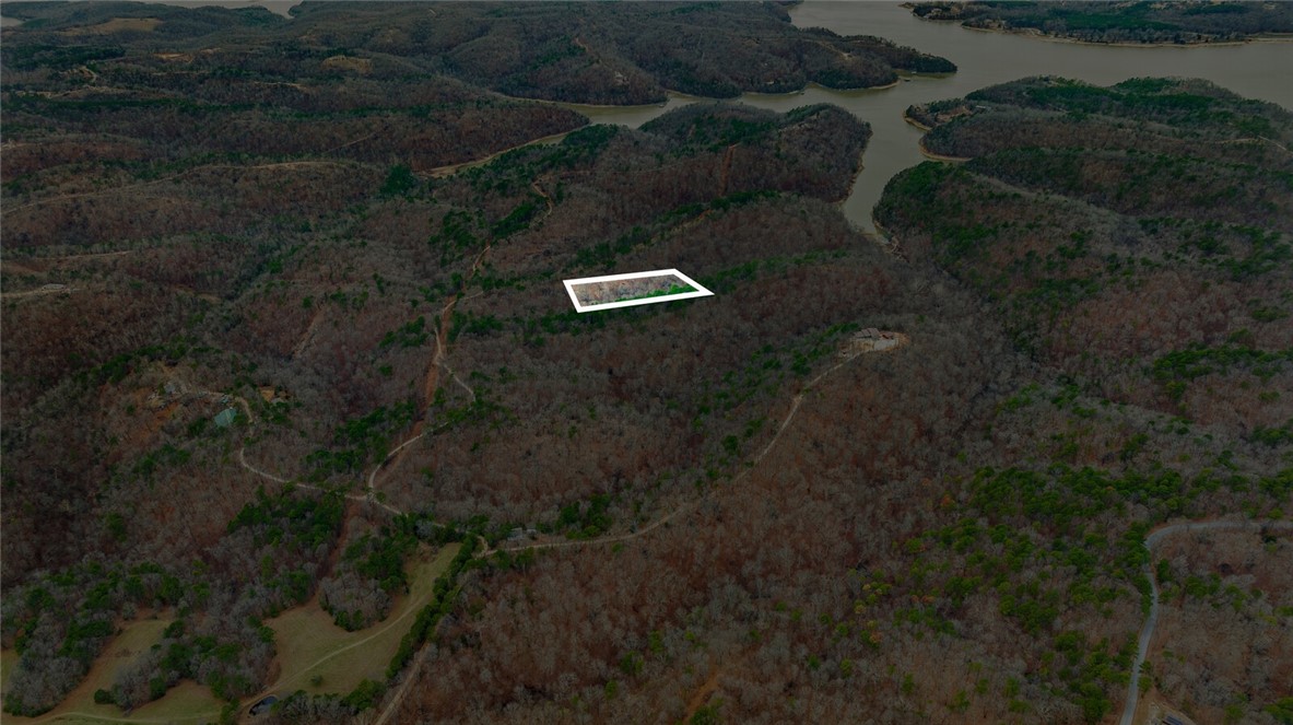 Discover the perfect canvas for your dream home with this stunning 5-acre tract in Emerald Bay subdivision. Boasting breathtaking views and endless potential, this property offers a serene retreat near the lake. While well water and septic are needed, electricity is already on-site, making your building process more convenient.
Located just minutes from the historic War Eagle Mill and a short drive to downtown Rogers, youāll enjoy the perfect balance of peaceful living and easy access to amenities. Whether youāre envisioning a custom home or a weekend getaway, this property provides the ideal setting to bring your vision to life. Donāt miss this rare opportunity to own a slice of Emerald Bay!
