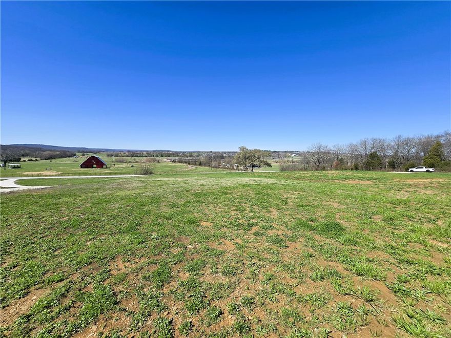 Take advantage of this exceptional opportunity to own 3.38 acres in the desirable Prairie Grove area, offering the ideal balance of country charm and everyday convenience. The property features gently rolling ground, a few mature trees, & gorgeous sunset views. This property has multiple building sites. A temporary driveway is also on site allowing for easy access to come view your new property. There is a fresh pad ready to go, electric & digital cable on site, & water access across the road. Water tap approval is in place. Tap will need to be purchased. Located only a couple miles from shopping, local schools, downtown Prairie Grove, and Highway 62, this property offers the quiet feel of rural living without sacrificing accessibility. With no restrictions, the possibilities are wide open—build your custom home, start a small hobby farm, nursery, whatever your heart desires. Opportunities like this are becoming harder to find in this growing area, making this a great place to build now or invest for the future.