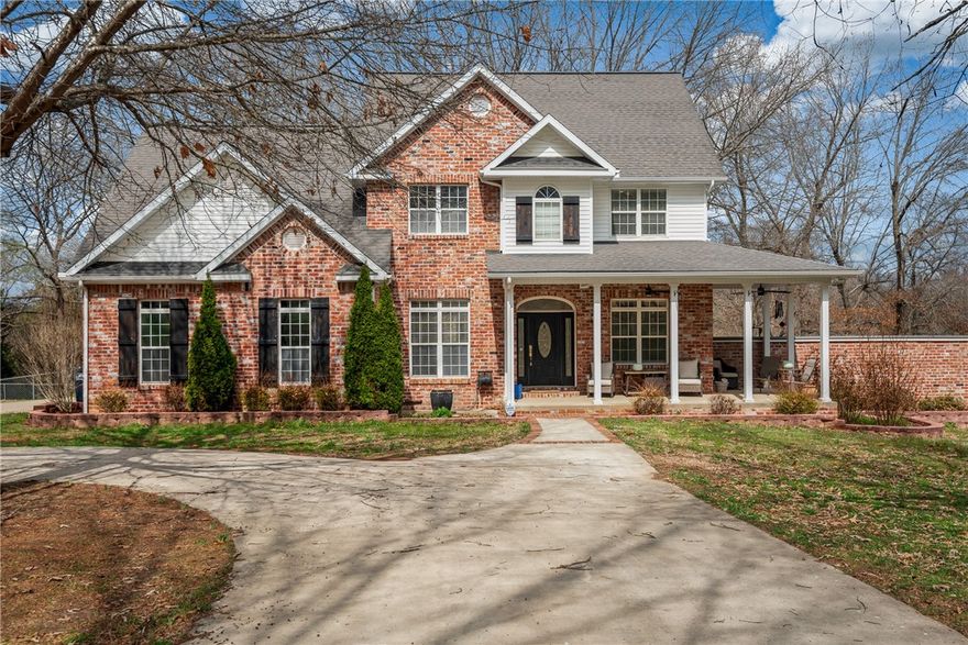 Nestled on a verdant, park-like lot, this distinguished home offers elegant living with room to expand. Featuring four bedrooms and four baths plus adaptable bonus rooms that can become additional bedrooms, the floorplan is ideal for growing needs. The lower level is built for fun and function theatre room with ambient lighting, a private workout room, an extra garage space, and a reinforced storm shelter/storage area. The kitchen shines with granite counters, upscale cabinetry, and top-tier appliances. Start your day on the inviting wraparound porch and entertain effortlessly on the large rear deck stylish, comfortable, and designed for entertaining.