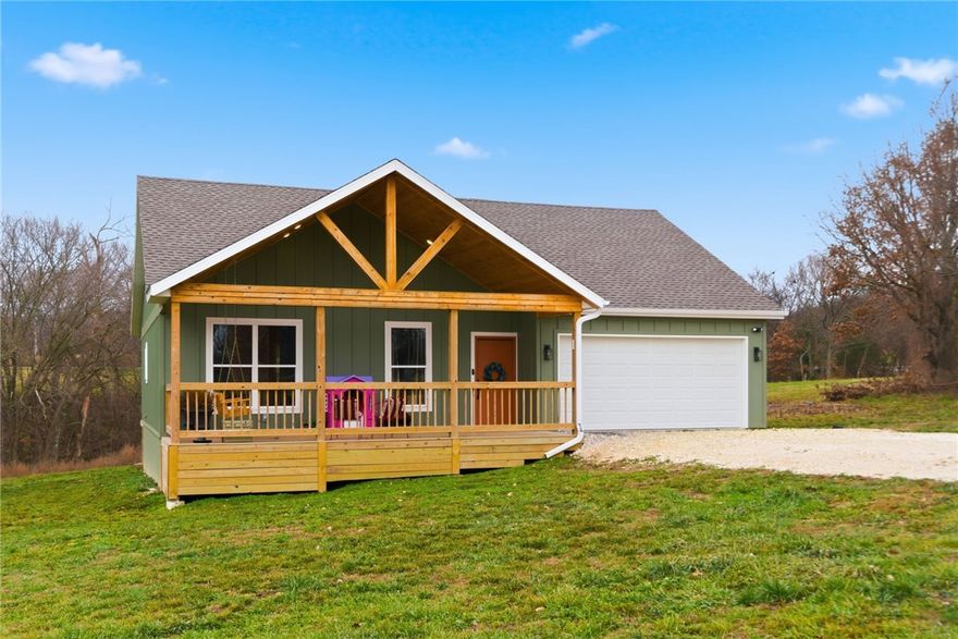 Nearly new construction on 3.44 acres with your own creek in Prairie Grove! Completed in November 2024, this thoughtfully designed 3-bedroom, 2-bath home offers modern finishes, smart design, and peaceful country surroundings just minutes from town. The standout feature? A huge 27’ x 10’ covered front porch — perfect for morning coffee or evening rewind. Inside you’ll find on-trend style with 9-foot ceilings, hard-surface flooring throughout, custom floor-to-ceiling cabinetry, built-ins, barn doors, stainless appliances, gas range, and a cozy fireplace that makes the space feel instantly like home. A two-car garage & storage shed add to everyday convenience, while the acreage gives you room to breathe, explore, and enjoy nature — a rare combination of brand-new living and quiet country lifestyle with easy access to Fayetteville. If you’ve been waiting for something new, private, and move-in ready… this is the one. School choice options available.