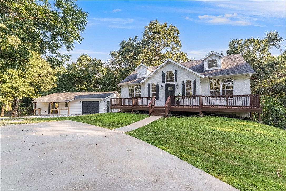 Escape the 8-to-5 and recharge in your private 6-acre retreat, just 15 min from Downtown Bentonville. This 3,600 sq/ft modern farmhouse blends charming warmth with simple, functional designāfeaturing open concept living, quartz countertops, hard surface flooring, and abundant natural light. A separate ADA-accessible guest house is perfect for multi-generational living or visitors. The detached office/gym with private entrance and mini-split HVAC is ideal for remote work or wellness. Outdoors, create your own farm-to-table experienceāgarden, raise animals, unwind in the hot tub, or gather by the fire pit. Surrounding wooded acres offer total privacy while keeping you close to all the dining, culture, and trail systems Northwest Arkansas is known for. New roof (2021), HVAC (2025), and appliances with transferable warranties. This home is more than a placeāitās your personal retreat, designed to restore and inspire.
