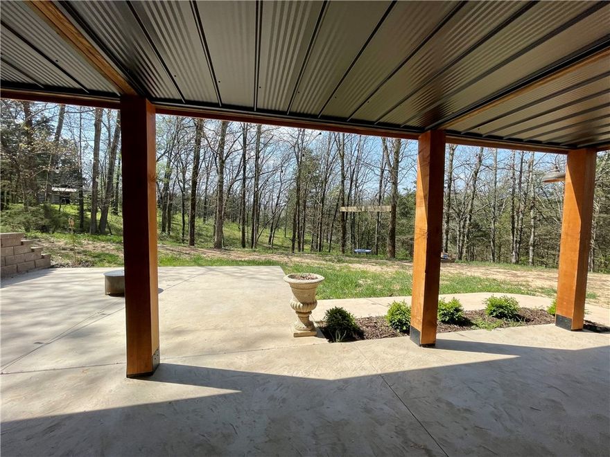Situated in the Ozarks,this property showcases stunning views,a private & secluded setting, paved roads on 10.73 acres m/l. Improvements with added concrete sidewalks,driveway,a finished basement, new siding & roof on garage & studio apartment with full bath,plumbed & ready for kitchenette, heated & cooled joined by a 2 car garage with lots of room for storage. 2484 sq ft home 3bed/2bath,2 emerg heat options,wood burning stove & propane wall unit.Updated kitchen.New tile/carpet.Wonderful deck to enjoy your own private landscape. Great for outdoor entertaining all year! A roomy finished basement with its own private entrance 1bed/1bath.This property offers great potential with the extra room for guest or extended family! Land has older chicken coop, pole shed for storage,room for animals,some fencing in place but needs work, wet weather creek, 32x50 pole shed offers storage for outdoor equipment & parking! Easy commute to all of NW AR. Approx 30 min or less to Fayetteville, AR & 15 min to Elkins/Huntsville,AR.