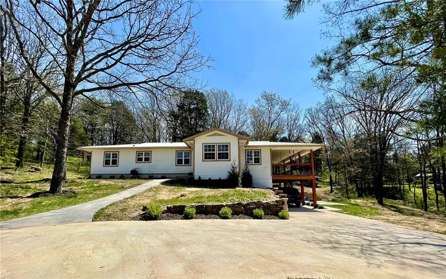 Situated in the Ozarks,this property showcases stunning views,a private & secluded setting,paved roads on 10.73 acres m/l.Improvements with added concrete sidewalks,driveway,a finished basement,new siding & roof on garage & studio apartment with full bath,plumbed & ready for kitchenette,heated & cooled joined by a 2 car garage with lots of room for storage.2484 sq ft home 3bed/2bath,2 emerg heat options,wood burning stove & propane wall unit.Updated kitchen.New tile/carpet.Wonderful deck to enjoy your own private landscape.Great for outdoor entertaining all year!A roomy finished basement with its own private entrance 1bed/1bath.This property offers great potential with the extra room for guest or extended family! Land has older chicken coop,pole shed for storage,room for animals,some fencing in place but needs work, wet weather creek,32x50 pole shed offers storage for outdoor equipment & parking!Easy commute to all of NW AR.Approx 30 min or less to Fayetteville, AR & 15 min to Elkins/Huntsville,AR.See MLS#1332455