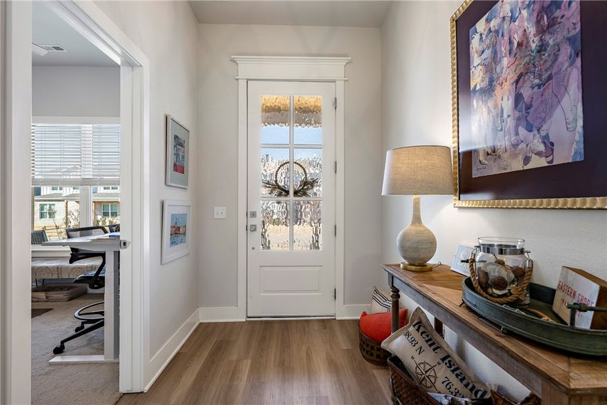 Sunlit interiors & Resort amenities w/i 15 minutes to: XNA Airport, Walmart's new Home Office, Mercy Hosp., DT Bentonville & Walmart AMP. Here you're at the center of NWA without the chaos. Open-concept that is flooded with natural light, making every room feel expansive and alive. The kitchen features KitchenAid Prof. Series Appliances & Fridge bringing a chef’s touch to everyday living.  A rear-entry garage keeps the streetscape clean and picture-perfect. The covered back porch is your personal sunrise spot every single morning. The common area next door means no one can ever build there, your privacy and your views are locked in for good. Small yard, Low maintenance, More time for living.  In the evening, stroll through the landscaped common areas with abundant decorative lighting. Aurora's amenities: 2 pools (1 adults-only), pickleball, open-air clubhouse, walking trails, a dog park, and picnic areas designed for real outdoor living. This is one will surely steal your heart!