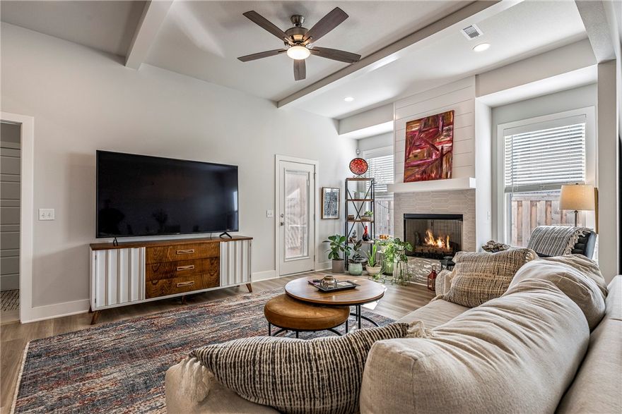 Built in 2023, this exceptional home blends modern design with comfortable, family-focused living in Bentonville’s Aurora Subdivision. Perfectly positioned beside a tranquil common area with mature trees and benches, the setting offers a rare sense of privacy while providing the ideal backdrop for morning coffee, evening walks, and outdoor play.
Thoughtfully designed for both style and function, the rear-entry garage—conveniently accessed from the alley—enhances curb appeal and creates a charming, pedestrian-friendly streetscape that encourages a true neighborhood feel.  residents enjoy resort-inspired amenities including two swimming pools (one adults-only), a pickleball court, open-air clubhouse, scenic walking trails, a dog park, and picnic areas.  A standout value, the seller has prepaid the 2026 HOA dues and internet fees—an incredible added benefit that reduces upfront costs and allows you to settle in with confidence.