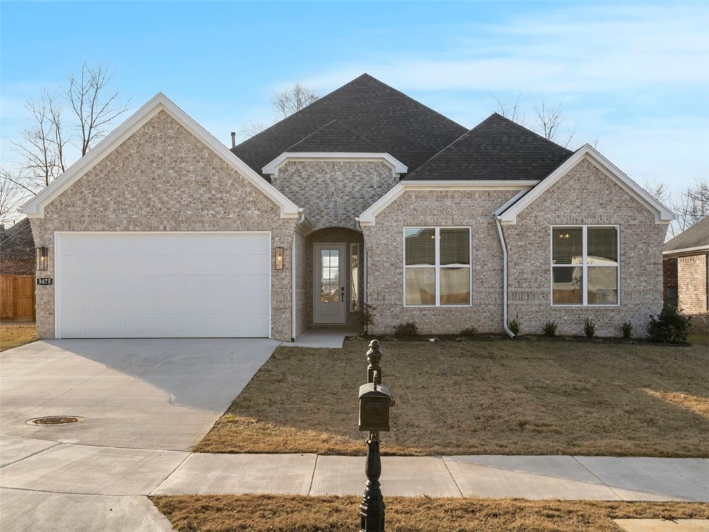 The lovely Kelsey plan in Hughmount, located in Fayetteville, Arkansas! The Kelsey plan includes 4 bedrooms, 3 baths, and 2465 square feet. These brand-new homes boast 4-sided brick and LVP flooring. Upon entering, you will find a spacious living area featuring a gas fireplace with a poplar mantle. The kitchen will have 42-inch cabinets, lovely appliances and quartz countertops and tile backsplash. The Primary bedroom has a fabulous en suite, dual sinks, with a walk-in shower with tiled walls and a soaking tub! These homes feature LED lighting throughout, and a high efficiency AC with programmable Wi-Fi thermostat. Come find your dream home today! Taxes and Parcel TBD. Garage Door Opener!