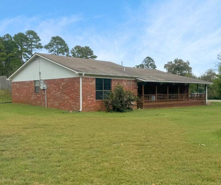 Nestled on a beautiful corner lot, this charming home offers a perfect blend of character and comfort. Set on 1.5 acres, the property provides plenty of space for outdoor enjoyment, including a refreshing pool and a large, covered front porch where you can relax and take in the serene surroundings. Inside, the home features 3 spacious bedrooms and 2 full bathrooms, offering comfortable living for the whole family. The enclosed porch provides 2 extras rooms, an ideal spot to have an office and hobby room, while the 2-car garage and multiple outbuildings offer abundant storage and workshop potential. This is a rare opportunity to own a spacious property with endless possibilities.