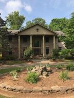 Beautiful home on the lake with boat dock. This property offers a remodeled home with wood cathedral ceiling, wood stair railing, custom floor-ceiling cabinets with granite, new flooring, wood doors, new paint, new light fixtures and fans, 3BR, 3.5BA, and office/playroom. Detaches garage with 1BR apartment. Enjoy the outdoors on the patio with fire pit or bring your boat docked just outside your door.