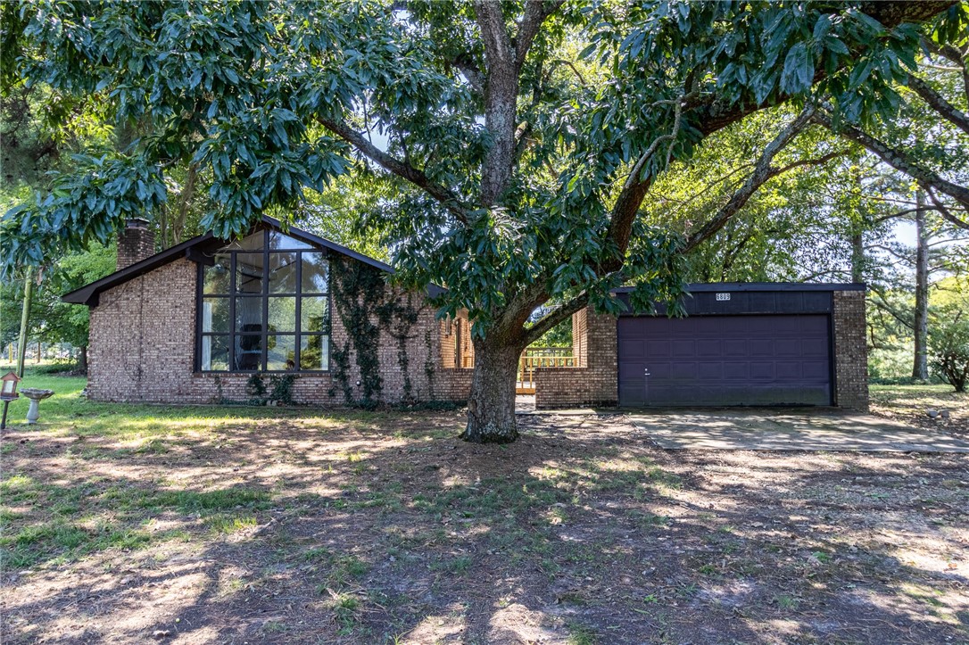 This custom-built, one-owner home is full of character and warmth. Step into the inviting living room where floor-to-ceiling windows fill the space with natural light and overlook the peaceful front pasture. The kitchen, with its generous cabinets and counter space, flows into the dining roomāperfect for sharing meals and memories. Enjoy relaxing or entertaining on the large deck, with plenty of room to take in the views. A spacious two-car detached garage and a brand-new roof add convenience and peace of mind. All of this sits on just over 5 acres, giving you the space and privacy to truly make it your own.