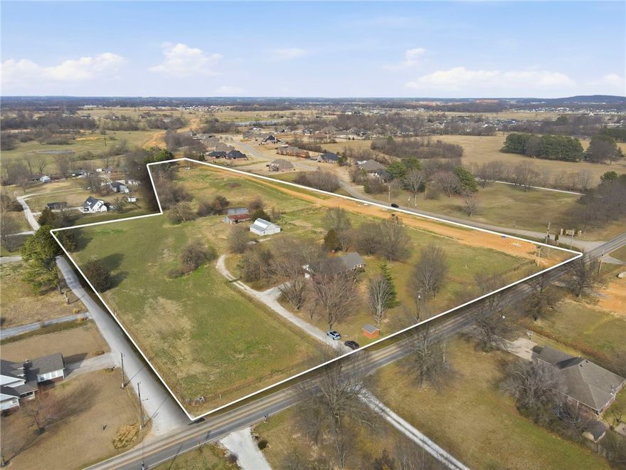 Exceptional 11.37-acre property on Elm Springs Road, just 6 miles from XNA Airport and Hwy 49. Prime location with strong development potential. Existing home offers renovation opportunity, while the acreage may allow for subdivision into multiple parcels (subject to approval). Ideal for investors, builders, or those seeking space with convenience.