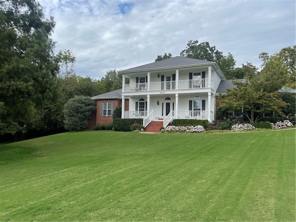 Welcome to Ridgemonte Estates on "Churchill" Drive! One owner custom built home that has been meticulously maintained! This home offers 2 story colonial-style porches for enjoyable morning and evening sunsets. Walk into gorgeous hardwood floors on the entire main floor. Primary Suite offers privacy with an office area and built-ins. Luxury awaits you in the claw foot tub or walk-in shower. French doors from the Primary Suite walk onto a 37'x30' composite deck with a natural gas fireplace. Cozy and comfortable describes the family room with a fireplace, built-ins, and a view of the 1100 sq. ft. deck and all the privacy you need on 2.31 acres. Gorgeous kitchen with breakfast bar and a 17'x23' sunroom. The upstairs offers 3 large bedrooms, one with a wet bar and built-ins, and easy access to the upstairs deck. 36'x35' detached 2 car garage and a 24'x21' attached for a total of 4 car garage and a new roof in 2021.